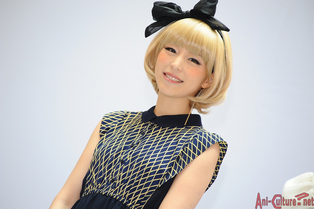Aya Hirano smiling brightly for the cameras.